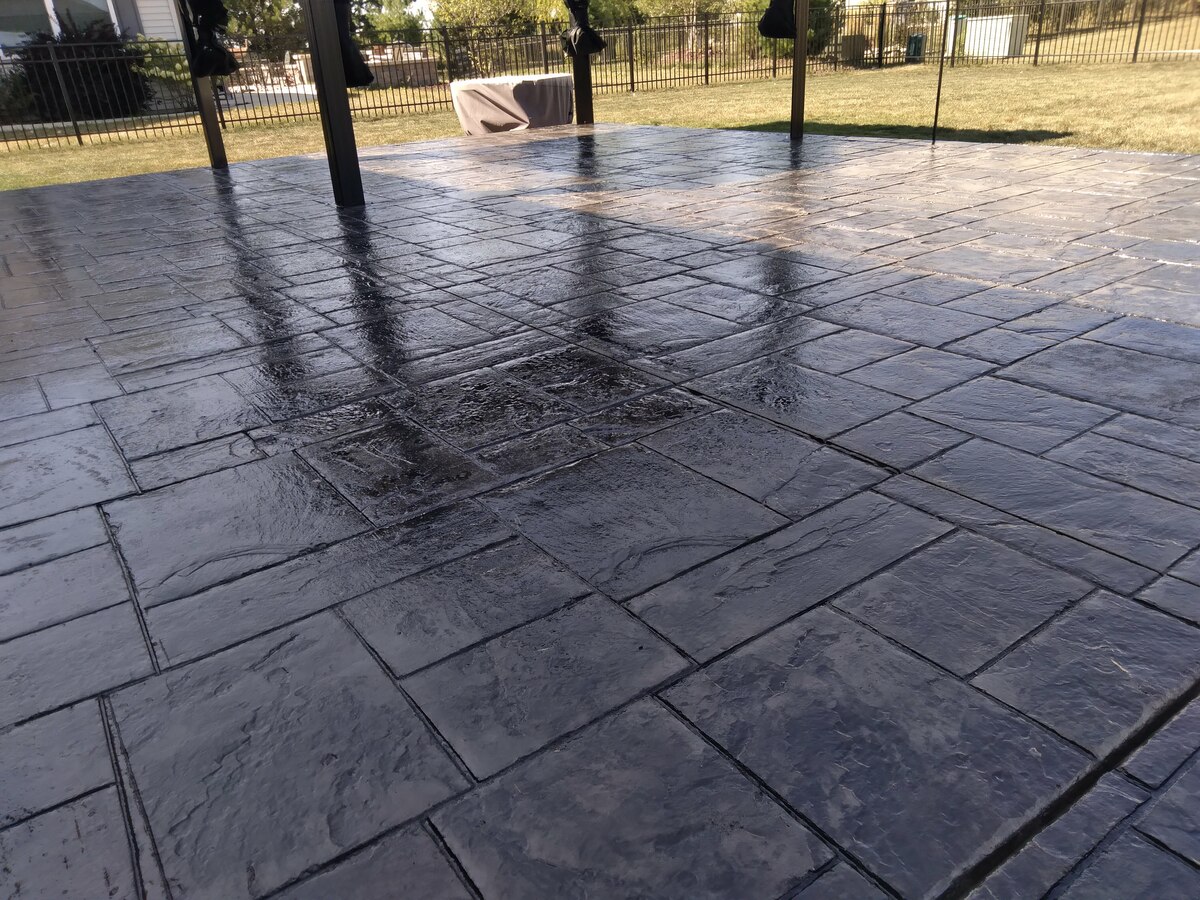Dark stamped concrete patio, close view